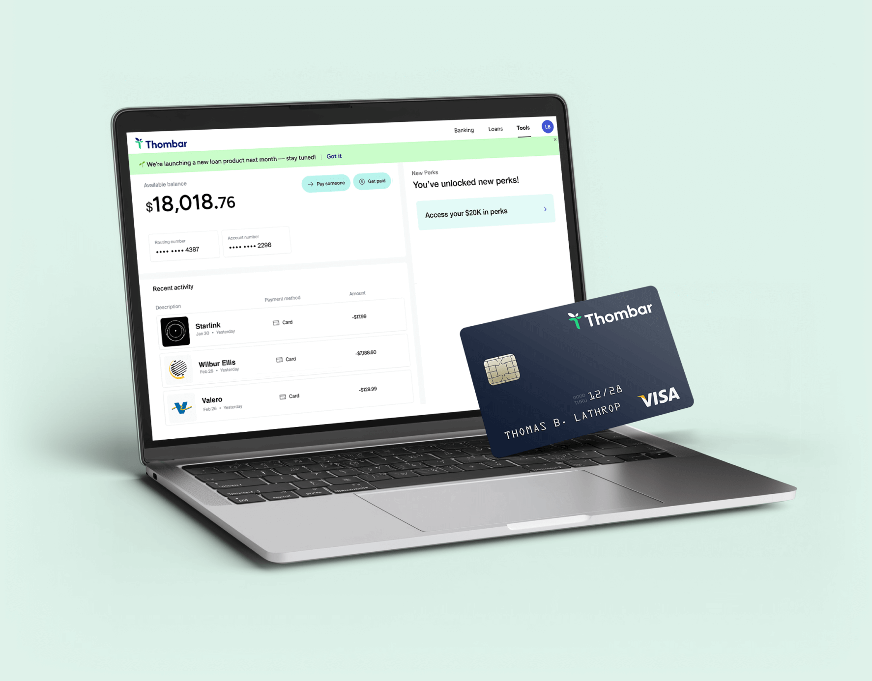 Thombar banking dashboard on laptop with card